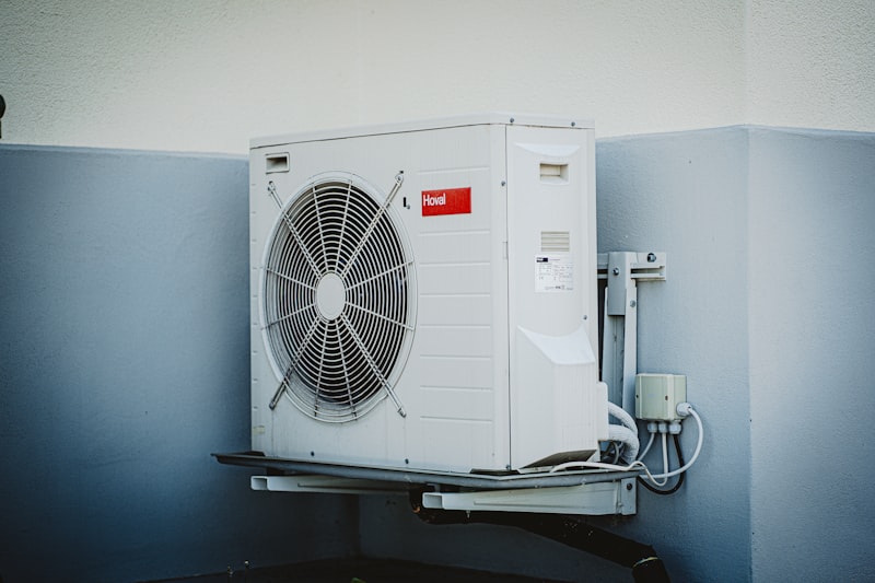 Professional appliance installation service connecting a new washer in a laundry room